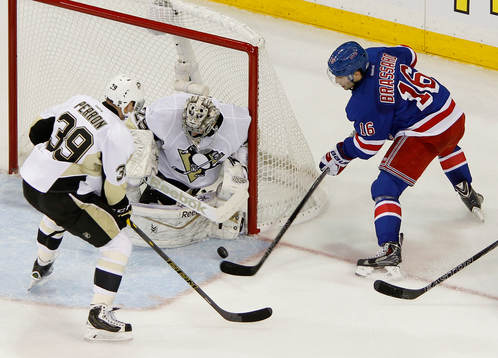 Pittsburgh Penguins goalie Marc-Andre Fleury (C) makes a
