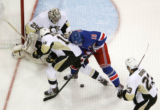 New York Rangers Jesper Fast (2nd R) fights for the puck