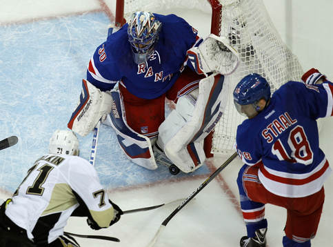 New York Rangers goalie Henrik Lundqvist (C) makes a skate