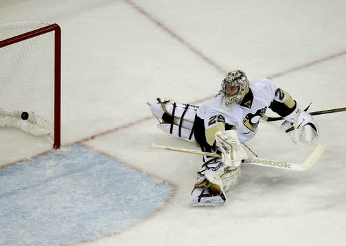 Pittsburgh Penguins goalie Marc-Andre Fleury looks at the