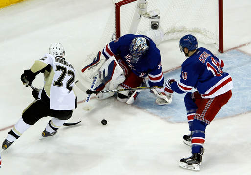 New York Rangers goalie Henrik Lundqvist makes a save in