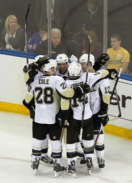 Pittsburgh Penquins Sidney Crosby (C) celebrates his first