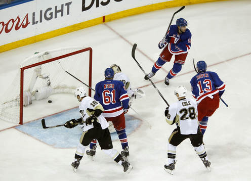 New York Rangers Derick Brassard (top R) celebrates scoring