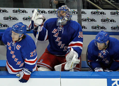 New York Rangers goalie Henrik Lundqvist (C) sits