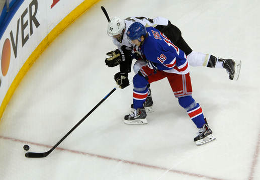 New York Rangers Jesper Fast (R) battles for the puck with