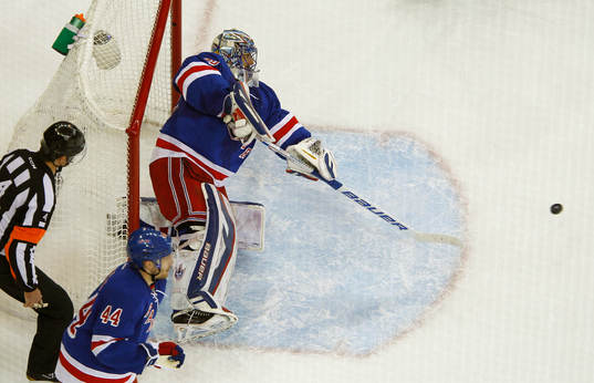 New York Rangers goalie Henrik Lundqvist shoots the puck