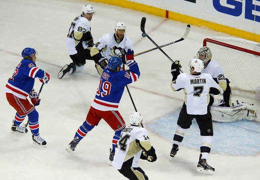 New York Rangers Jesper Fast (19) reaches for the puck with