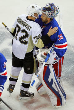 New York Rangers Henrik Lundqvist (R) embraces Pittsburgh