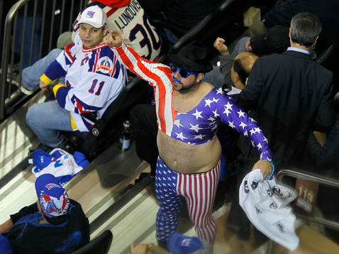 A fan cheers in the first period