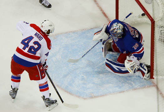 Washington Capitals Joel Ward (L) scores the game winning