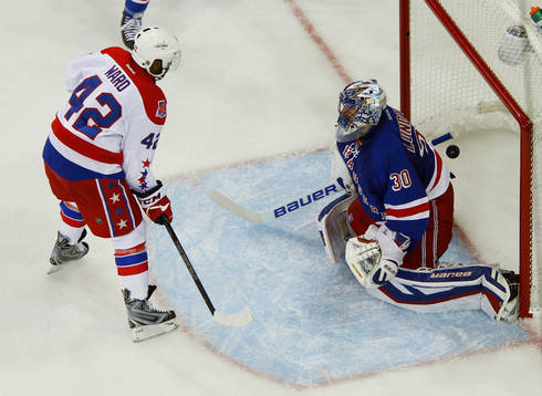 Washington Capitals Joel Ward (L) scores the game winning