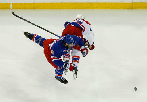New York Rangers James Sheppard is sent flying by