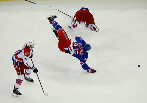 New York Rangers James Sheppard is sent flying by