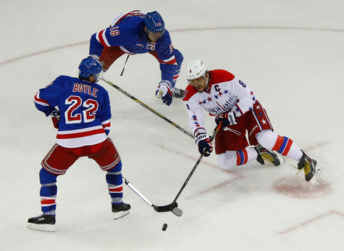 Washington Capitals Alex Ovechkin (R) is covered by New