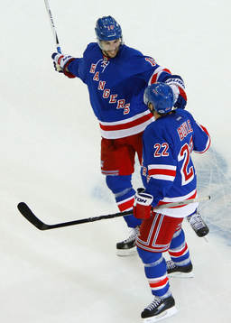 New York Rangers Dan Boyle (R) celebrate with teammate