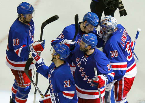 New York Rangers goalie Henrik Lundqvist taps heads with