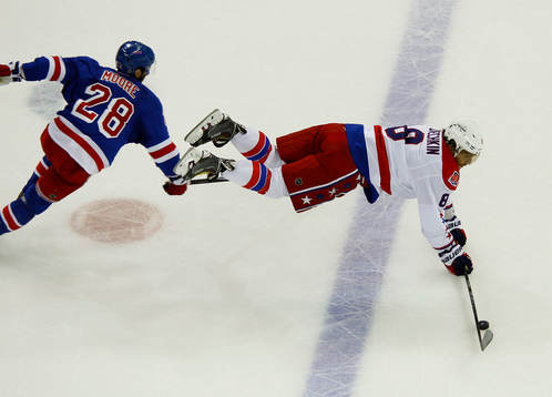 Washington Capitals Alex Ovechkin (R) is upended by New