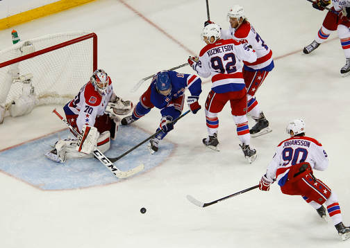 New York Rangers Jesper Fast chases the puck between