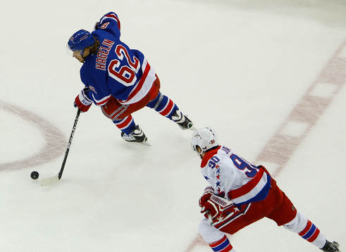 New York Rangers Carl Hagelin (L) skates away from