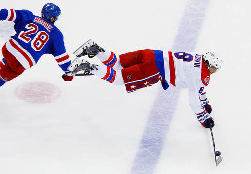 Washington Capitals Alex Ovechkin (R) is upended by New