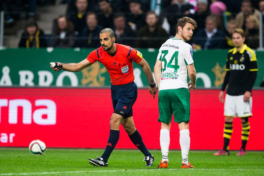Domare Mohammed Al-Hakim använder frisparksspray