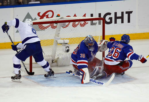 Tampa Bay Lightning Tyler Johnson (L) scores a goal past