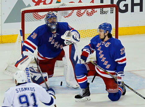 New York Rangers goalie Henrik Lundqvist (L) lets in the
