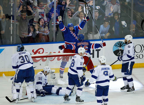 New York Rangers Derek Stepan (top) celebrates scoring with