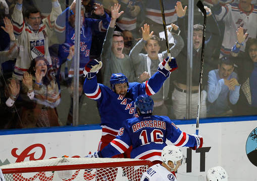 New York Rangers Derek Stepan (top) celebrates scoring with