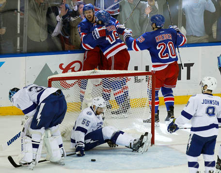 New York Rangers Derek Stepan (rear L) celebrates scoring