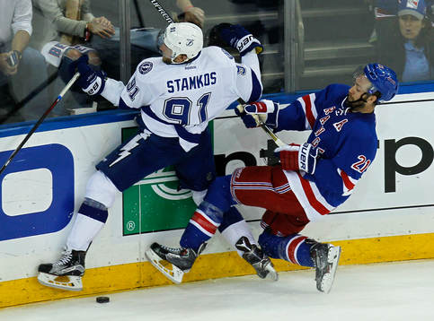 Tampa Bay Lightning Steven Stamkos (L) is checked into the