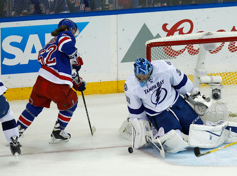 Tampa Bay Lightning goalie Ben Bishop (R) makes a save