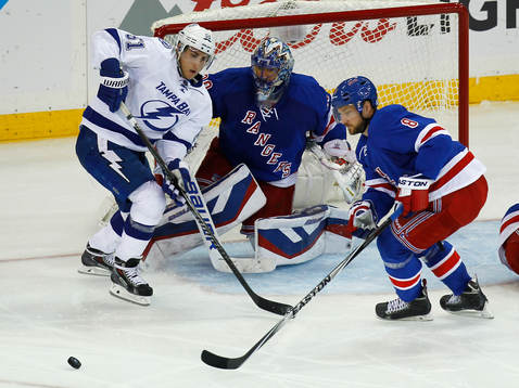 New York Rangers goalie Henrik Lundqvist (C) mmakes a save
