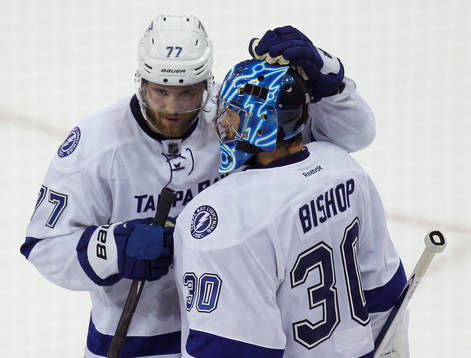 Tampa Bay Lightning goalie Ben Bishop (R) is congratulated
