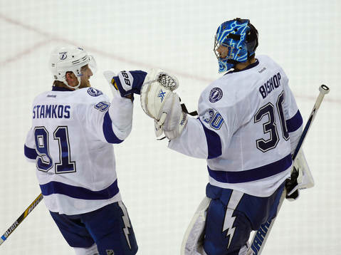 Tampa Bay Lightning goalie Ben Bishop (R) is congratulated