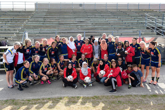 Laget tar en gruppbild