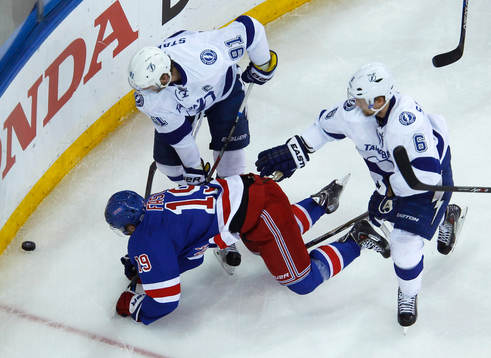 New York Rangers Jesper Fast (19) is knocked to the ice by