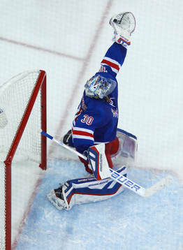 New York Rangers goalie Henrik Lundqvist makes a glove save