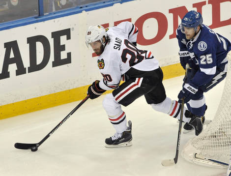 The Blackhawks' Brandon Saad (20) controls the puck
