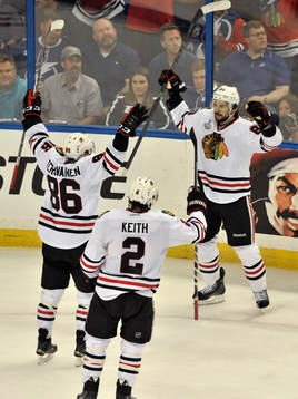 The Blackhawks' Teuvo Teravainen (86) and Duncan Kieth (2)