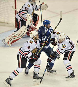 The Blackhawks' Niklas Hjalmarsson (4) and Jonathan Toews