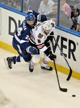 The Lightning's Ryan Callahan (24) pressures the