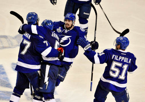 The Lightning's Victor Hedman (77), Jason Garrison (5),