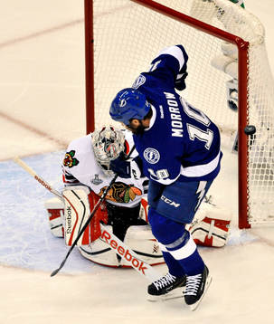 Blackhawks goalie Corey Crawford (50) deflects a shot from