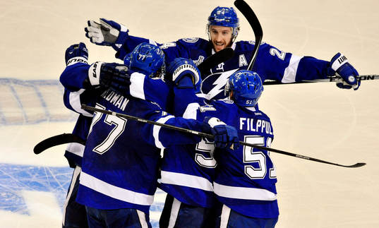 The Lightning's Victor Hedman (77), Jason Garrison (5),