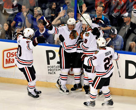 The Blackhawks' Brandon Saad (20) , Marian Hossa (81),