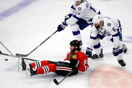 Chicago Blackhawks left wing Brandon Saad (20) falls while