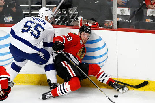 Chicago Blackhawks left wing Bryan Bickell (29) collides