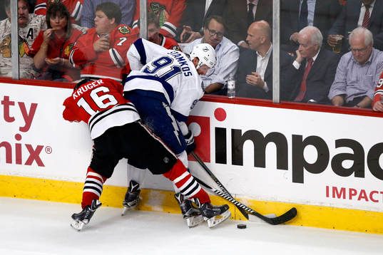 Chicago Blackhawks center Marcus Kruger (16) fights for the