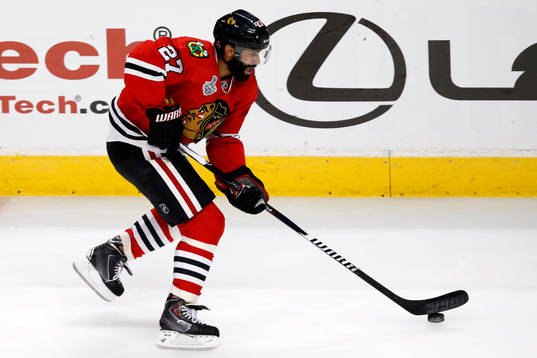 Chicago Blackhawks defenseman Johnny Oduya (27) skates with